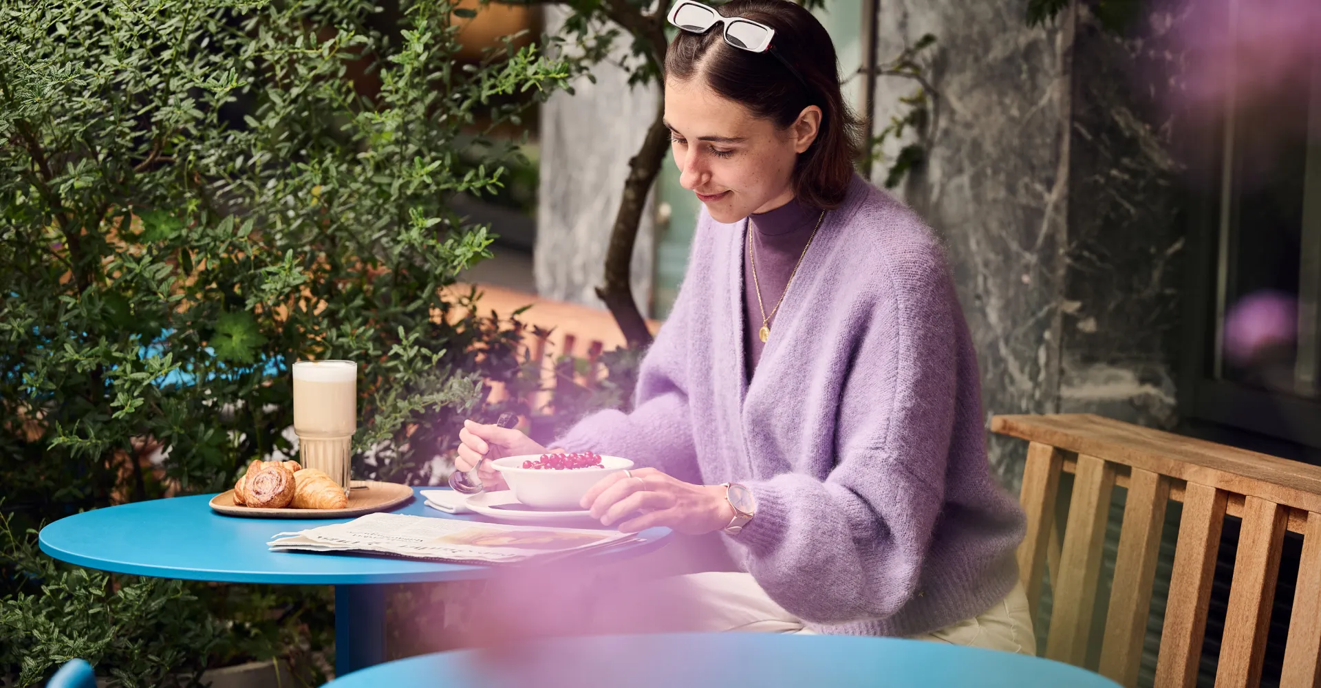 Woman drinking coffee on a terrace