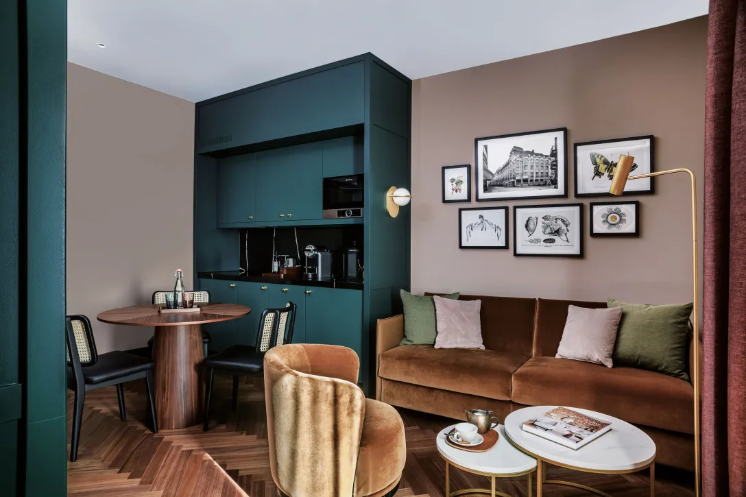 Sorell Hotel Seidenhof Suite with kitchenette and sitting area