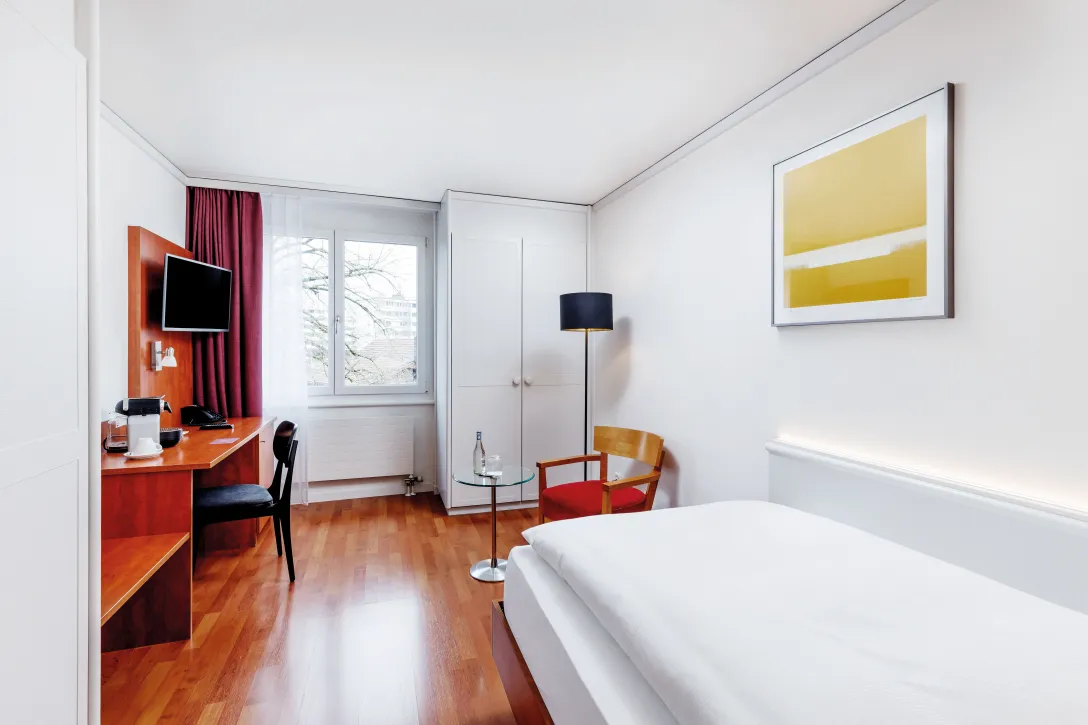 Sorell Hotel Sonnental Standard single room with sitting area and desk