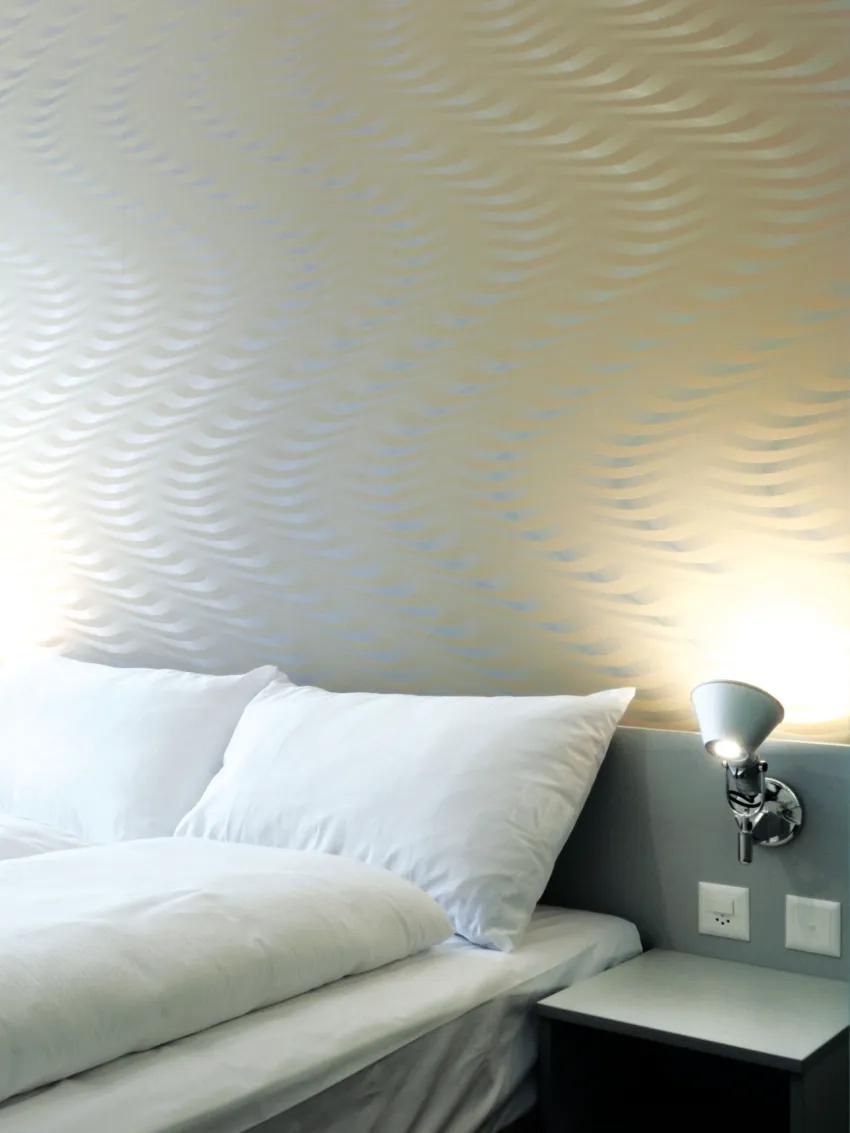 Close-up of a bed at the Hotel Ador